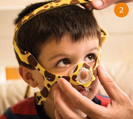 kid wearing sleep apnea mask